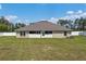 Large backyard featuring a lush green lawn and a white vinyl fence at 10910 Sw 41St Ave, Ocala, FL 34476