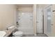 Bright bathroom features a shower-tub combination and a modern vanity at 10910 Sw 41St Ave, Ocala, FL 34476