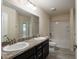 Bathroom featuring double sinks and shower-tub combo at 10910 Sw 41St Ave, Ocala, FL 34476