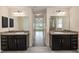 This bathroom offers dual vanities and sinks, providing convenience and style to the space at 10910 Sw 41St Ave, Ocala, FL 34476