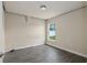A cozy bedroom with neutral walls, modern flooring, and a bright window for natural light at 10910 Sw 41St Ave, Ocala, FL 34476