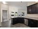 Well-appointed kitchen featuring an island and stainless steel dishwasher at 10910 Sw 41St Ave, Ocala, FL 34476