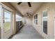 Covered patio featuring two ceiling fans, and view of the large backyard at 10910 Sw 41St Ave, Ocala, FL 34476
