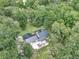 Aerial view of the property showcasing the home's layout and lush surroundings at 12677 Se 53Rd Terrace Rd, Belleview, FL 34420
