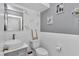 Stylish bathroom with unique wall decor, modern fixtures, and a vessel sink at 12677 Se 53Rd Terrace Rd, Belleview, FL 34420