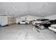 Spacious garage featuring multiple cars and ample parking, perfect for car enthusiasts and storage at 12677 Se 53Rd Terrace Rd, Belleview, FL 34420