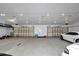 Large garage with multiple bay doors and ample space for parking vehicles and storage at 12677 Se 53Rd Terrace Rd, Belleview, FL 34420