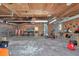 Unfinished garage with tools, work benches, and shelving, offering ample storage and project space at 12677 Se 53Rd Terrace Rd, Belleview, FL 34420