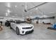 Large garage featuring multiple cars and ample space for storage and hobbies at 12677 Se 53Rd Terrace Rd, Belleview, FL 34420