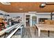 Garage featuring workbench and storage shelving; ideal for DIY projects and organization at 12677 Se 53Rd Terrace Rd, Belleview, FL 34420