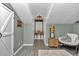 Hallway with gray wood floors, and decor with a small sitting space and accent furniture at 12677 Se 53Rd Terrace Rd, Belleview, FL 34420