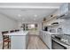 Beautiful kitchen with a large island, stainless steel appliances, and modern finishes, perfect for Gathering and entertaining at 12677 Se 53Rd Terrace Rd, Belleview, FL 34420