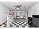 Bright living space with checkered floors, ceiling fan, and open layout perfect for entertaining at 12677 Se 53Rd Terrace Rd, Belleview, FL 34420