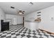 Bright living space with checkered floors, ceiling fan, and open layout perfect for entertaining at 12677 Se 53Rd Terrace Rd, Belleview, FL 34420