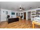 Bright office space with wood floors, ceiling fan, and built-in shelving at 12677 Se 53Rd Terrace Rd, Belleview, FL 34420