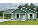 Charming single-Gathering home with a well-manicured lawn, inviting entrance, and neutral color palette at 13319 Sw 106Th Pl, Dunnellon, FL 34432