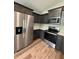 Well-equipped kitchen featuring stainless steel appliances and dark wood cabinetry, blending style with functionality at 13319 Sw 106Th Pl, Dunnellon, FL 34432