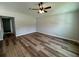 Spacious living room with wood-look flooring, providing a warm and inviting atmosphere for relaxation at 13319 Sw 106Th Pl, Dunnellon, FL 34432