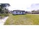 A lush, green backyard offers ample space and complements the home's exterior at 15215 Sw 43Rd Ct, Ocala, FL 34473