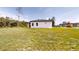 A well-maintained backyard features lush grass, providing ample space for outdoor activities and relaxation at 15215 Sw 43Rd Ct, Ocala, FL 34473