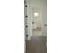 A glimpse of a modern bathroom featuring a standalone tub and neutral color scheme at 15215 Sw 43Rd Ct, Ocala, FL 34473
