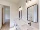 Bathroom with double sinks, large mirrors, stylish fixtures, and a bright, open layout, perfect for Gathering at 15215 Sw 43Rd Ct, Ocala, FL 34473
