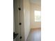 Cozy bedroom with light wood floors, a white-framed window, and white walls at 15215 Sw 43Rd Ct, Ocala, FL 34473