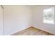 A bright bedroom with a window and modern flooring, providing a comfortable and serene space at 15215 Sw 43Rd Ct, Ocala, FL 34473