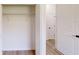 A walk-in closet features wire shelving and an open view to the hall and other interior doors at 15215 Sw 43Rd Ct, Ocala, FL 34473