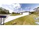 New home's exterior features a spacious driveway leading to a two-car garage at 15215 Sw 43Rd Ct, Ocala, FL 34473