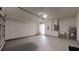 Bright garage with a utility sink, water heater, and easy access to the house at 15215 Sw 43Rd Ct, Ocala, FL 34473