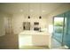 Bright kitchen with a center island, stainless steel appliances, and light wood floors at 15215 Sw 43Rd Ct, Ocala, FL 34473