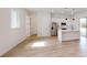 A stylish, modern kitchen with an island, stainless steel appliances, and light wood-look flooring at 15215 Sw 43Rd Ct, Ocala, FL 34473