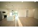 Open kitchen layout featuring stainless steel appliances, an island, and sliding glass doors to backyard at 15215 Sw 43Rd Ct, Ocala, FL 34473