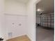 Laundry room with washer and dryer hookups conveniently near the garage at 15215 Sw 43Rd Ct, Ocala, FL 34473