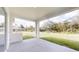 Covered patio with view of green lawn and landscaped backyard at 15215 Sw 43Rd Ct, Ocala, FL 34473
