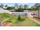 Backyard features an above-ground pool and landscaping, ideal for outdoor activities at 15324 Sw 40Th Place Rd, Ocala, FL 34481