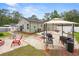 Enjoy grilling and outdoor dining in this backyard, complete with a gazebo, and brick-paved walkways at 15324 Sw 40Th Place Rd, Ocala, FL 34481