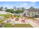 This backyard features a fire pit, and multiple seating areas for entertaining outdoors at 15324 Sw 40Th Place Rd, Ocala, FL 34481