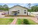 The home's backyard features landscaping, a shed, and a patio seating area at 15324 Sw 40Th Place Rd, Ocala, FL 34481