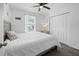 Comfortable bedroom with a ceiling fan, closet, and a view from the window at 15324 Sw 40Th Place Rd, Ocala, FL 34481