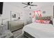 Bedroom boasts a bed, mirror, dresser, and a ceiling fan at 15324 Sw 40Th Place Rd, Ocala, FL 34481