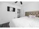 Bedroom with a ceiling fan and view to the bathroom at 15324 Sw 40Th Place Rd, Ocala, FL 34481