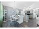 Dining area with modern chandelier, a kitchen bar and seating at 15324 Sw 40Th Place Rd, Ocala, FL 34481