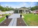Charming single-story home with a well-manicured lawn and decorative landscaping at 15324 Sw 40Th Place Rd, Ocala, FL 34481