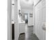 Hallway features modern flooring, storage, and views of the bedroom and bathroom at 15324 Sw 40Th Place Rd, Ocala, FL 34481