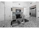Kitchen island boasts granite countertops and a stainless steel sink, with modern appliances at 15324 Sw 40Th Place Rd, Ocala, FL 34481