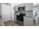 Well-lit kitchen with stainless steel appliances, including a microwave and range at 15324 Sw 40Th Place Rd, Ocala, FL 34481