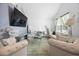 Comfortable living room featuring modern decor and a large television for entertainment at 15324 Sw 40Th Place Rd, Ocala, FL 34481