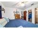 Comfortable bedroom featuring a bed, ceiling fan, and closet at 17128 Se 140Th Ave, Weirsdale, FL 32195